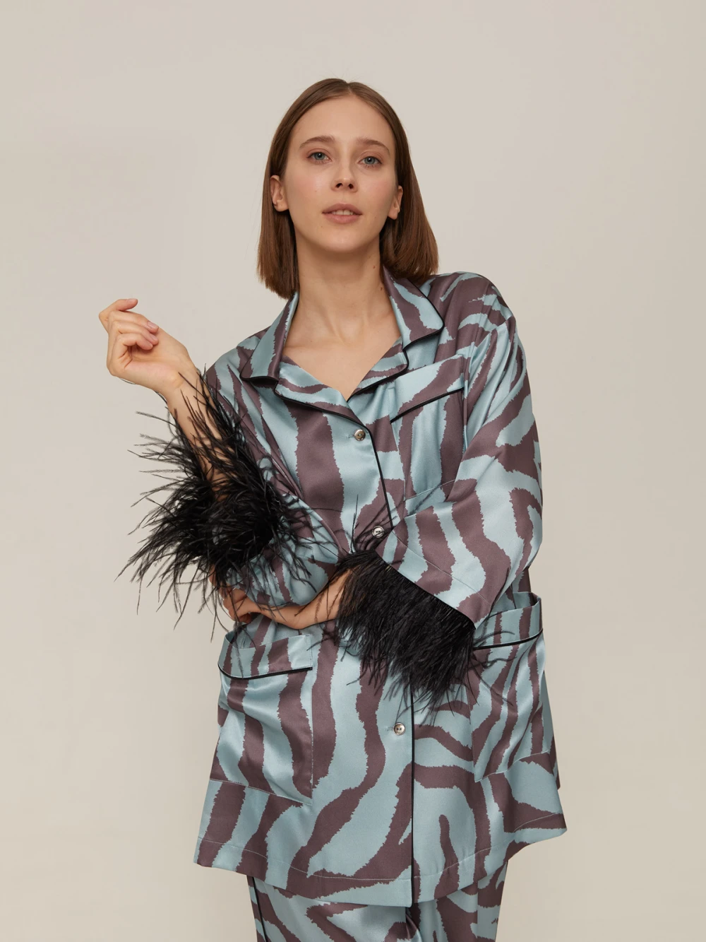 Костюм Vivien ( Цвет Голубой с анималистическим принтом, с отделкой перья )